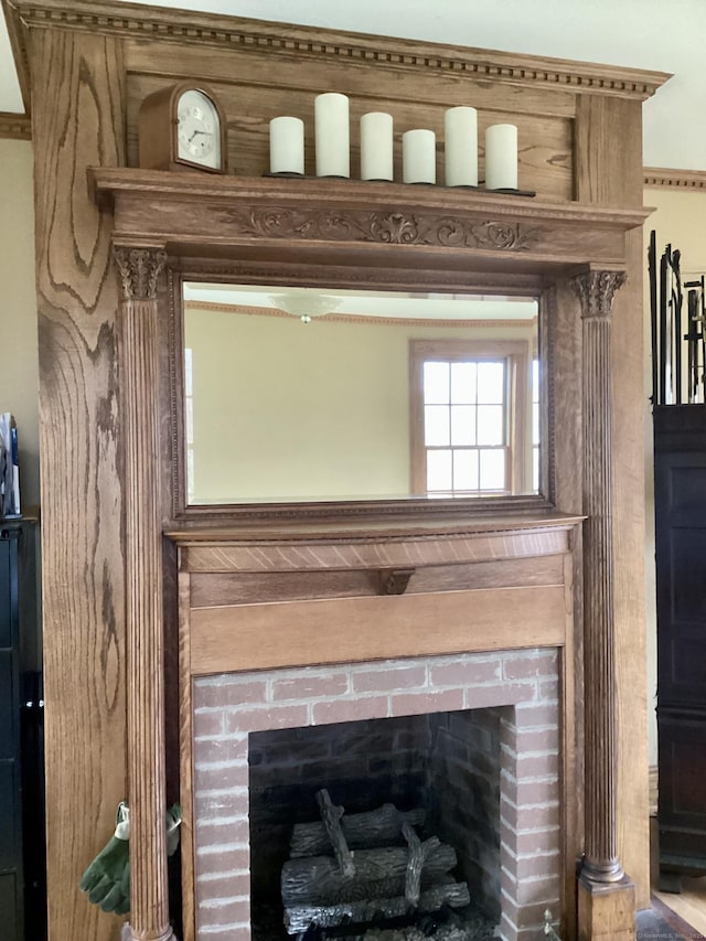 details with a brick fireplace