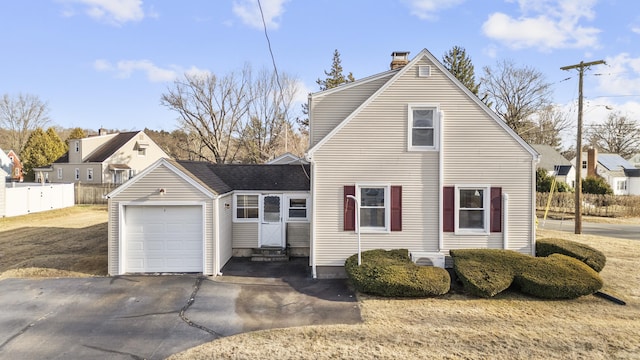 view of side of home featuring a garage