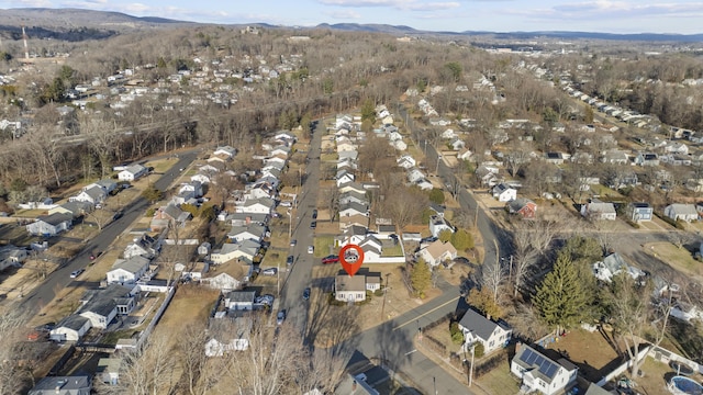 birds eye view of property with a mountain view