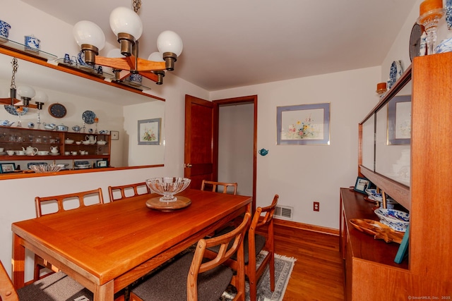 dining area featuring hardwood / wood-style floors