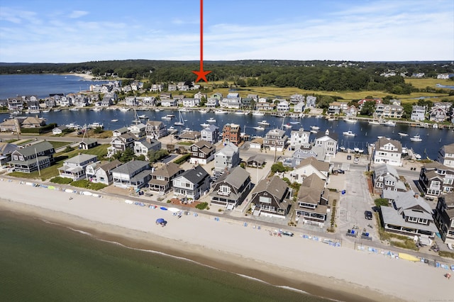 aerial view with a beach view and a water view