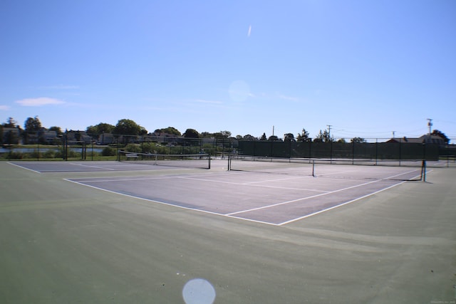 view of tennis court featuring basketball court