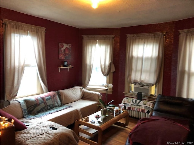 living room featuring hardwood / wood-style floors and cooling unit