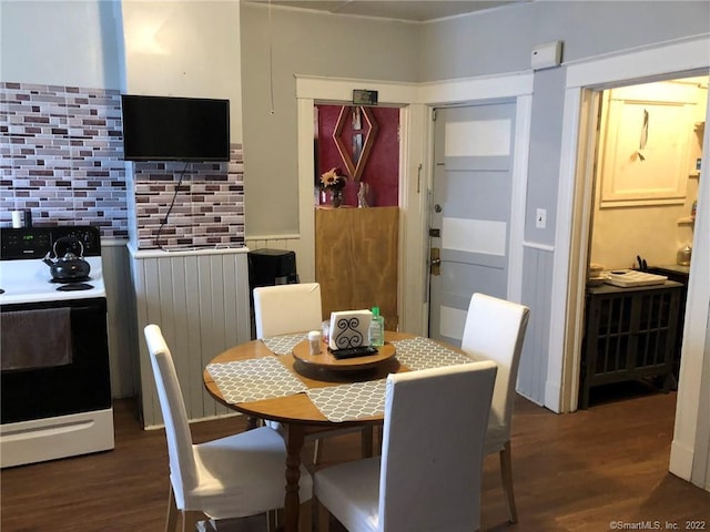 dining space featuring dark wood-type flooring