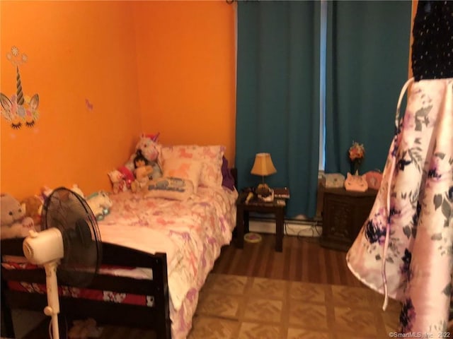 bedroom with dark wood-type flooring