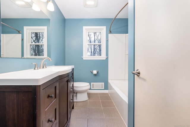 full bathroom featuring vanity, toilet, and shower / washtub combination