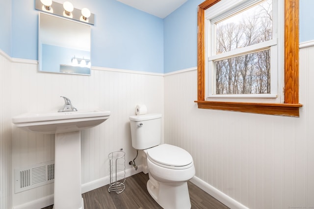 bathroom featuring hardwood / wood-style flooring, sink, and toilet