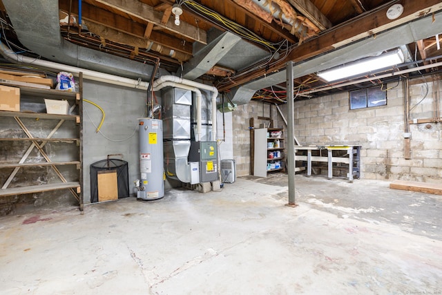 basement featuring heating unit and water heater