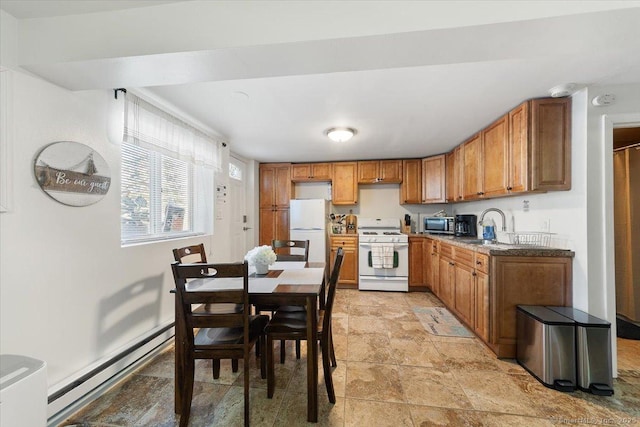 kitchen featuring white appliances, sink, and a baseboard heating unit