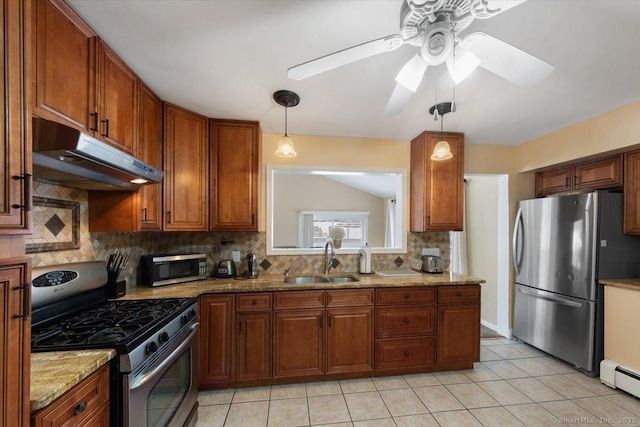 kitchen with sink, a baseboard radiator, backsplash, pendant lighting, and appliances with stainless steel finishes