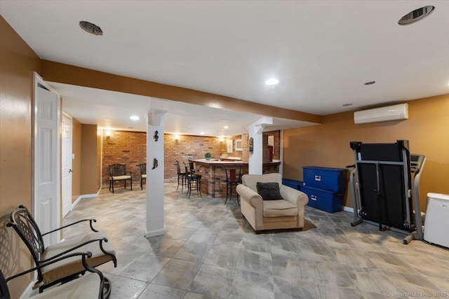 basement featuring bar area, brick wall, and a wall mounted AC