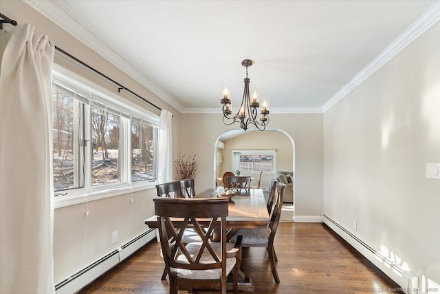 dining area with ornamental molding, dark hardwood / wood-style flooring, a baseboard heating unit, and a notable chandelier