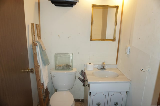 bathroom with toilet and vanity