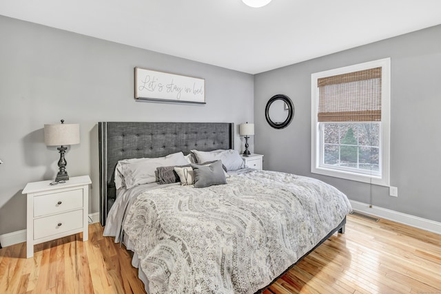 bedroom with light wood-type flooring