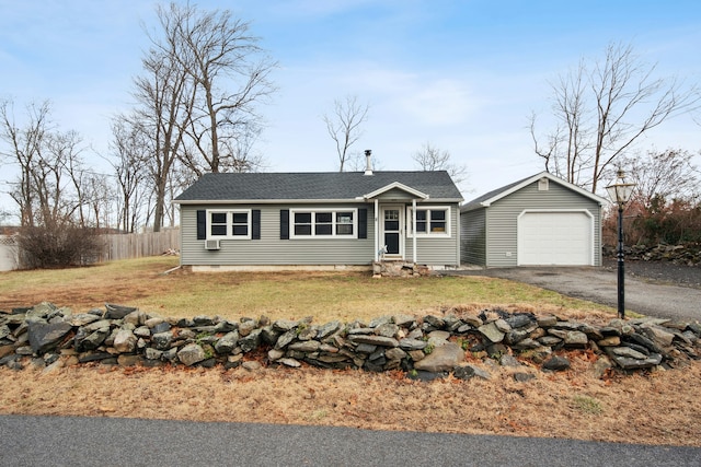 single story home with a garage and a front lawn