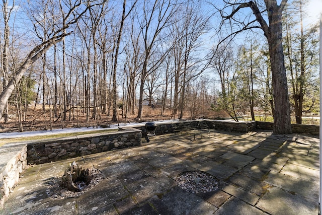 wooden deck with a patio