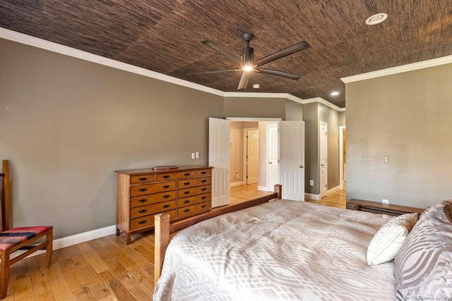 bedroom featuring hardwood / wood-style floors, ceiling fan, wooden ceiling, and crown molding