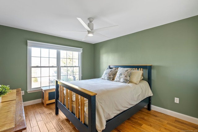 bedroom featuring light wood-type flooring and ceiling fan