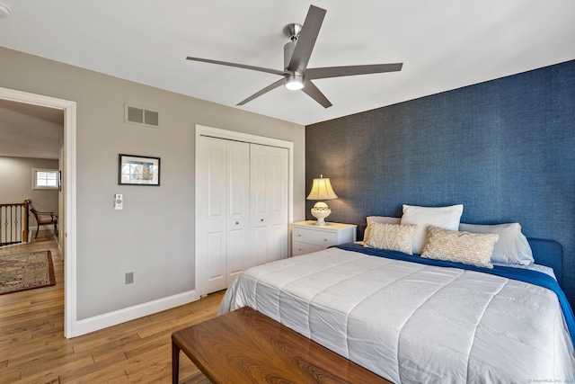 bedroom featuring a closet, ceiling fan, and light hardwood / wood-style floors