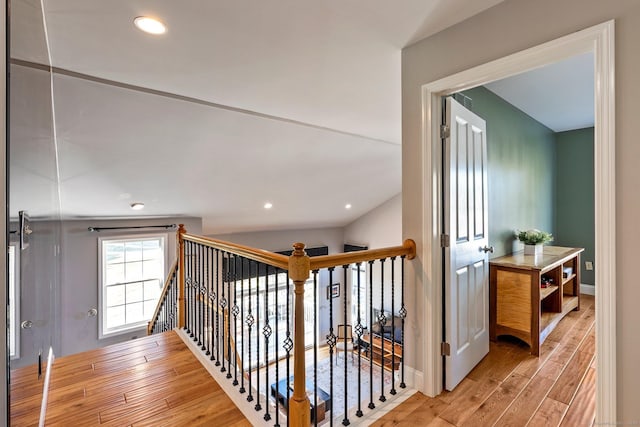 staircase with hardwood / wood-style flooring