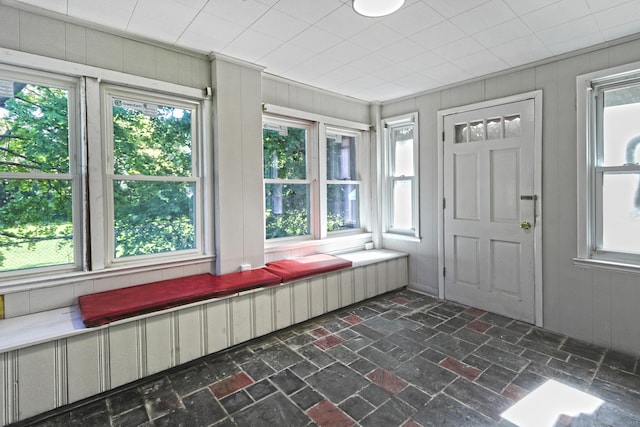 unfurnished sunroom featuring a wealth of natural light