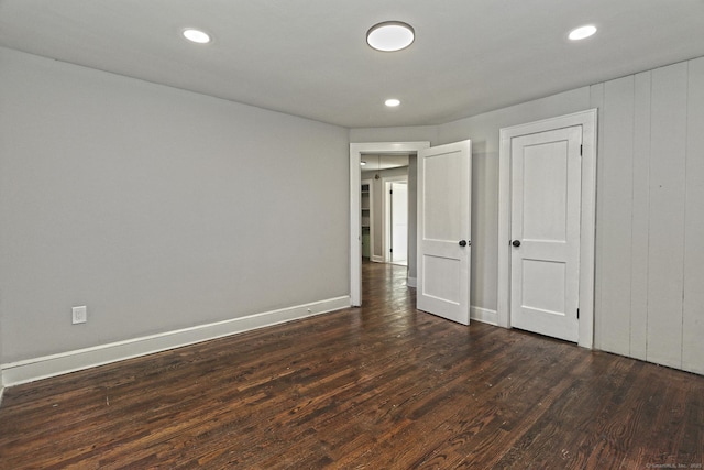 spare room featuring dark hardwood / wood-style flooring