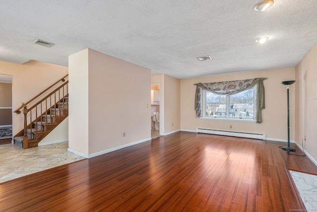 16 Snow Rdg S, Middletown, CT 06457 - unfurnished living room with visible vents, a baseboard radiator, and hardwood / wood-style flooring