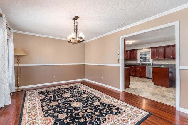 16 Snow Rdg S, Middletown, CT 06457 - dining room with crown molding, light wood-type flooring, and a notable chandelier