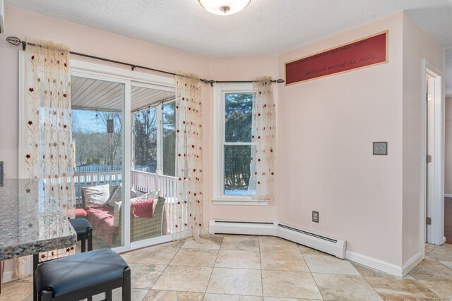 16 Snow Rdg S, Middletown, CT 06457 - interior space with baseboards, a textured ceiling, and baseboard heating