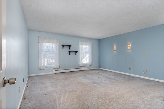 16 Snow Rdg S, Middletown, CT 06457 - carpeted empty room featuring a textured ceiling, baseboards, and a baseboard radiator