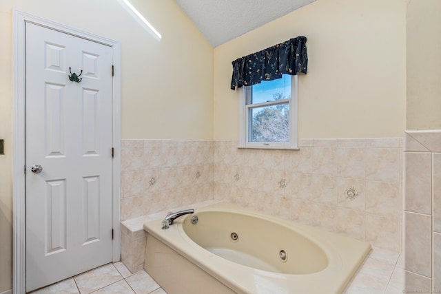 16 Snow Rdg S, Middletown, CT 06457 - full bathroom with a textured ceiling, vaulted ceiling, tile patterned floors, a wainscoted wall, and a whirlpool tub
