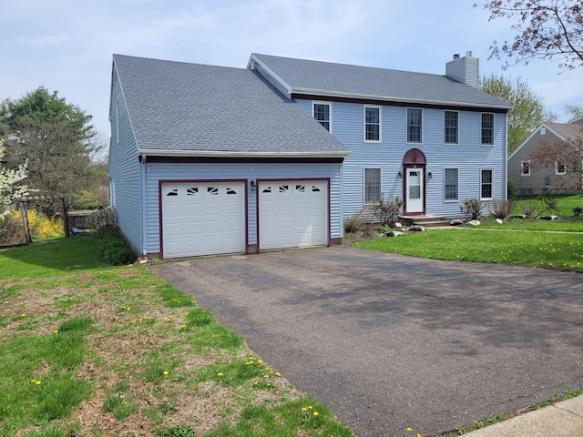 16 Snow Rdg S, Middletown, CT 06457 - colonial house featuring a shingled roof, an attached garage, aphalt driveway, a front yard, and a chimney