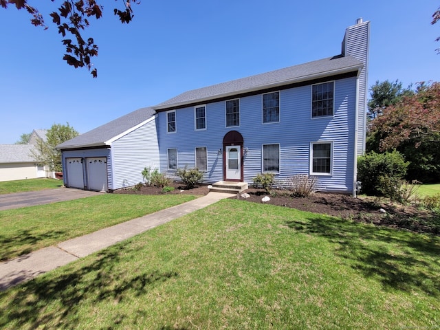 16 Snow Rdg S, Middletown, CT 06457 - colonial house with a chimney, an attached garage, a front yard, and aphalt driveway