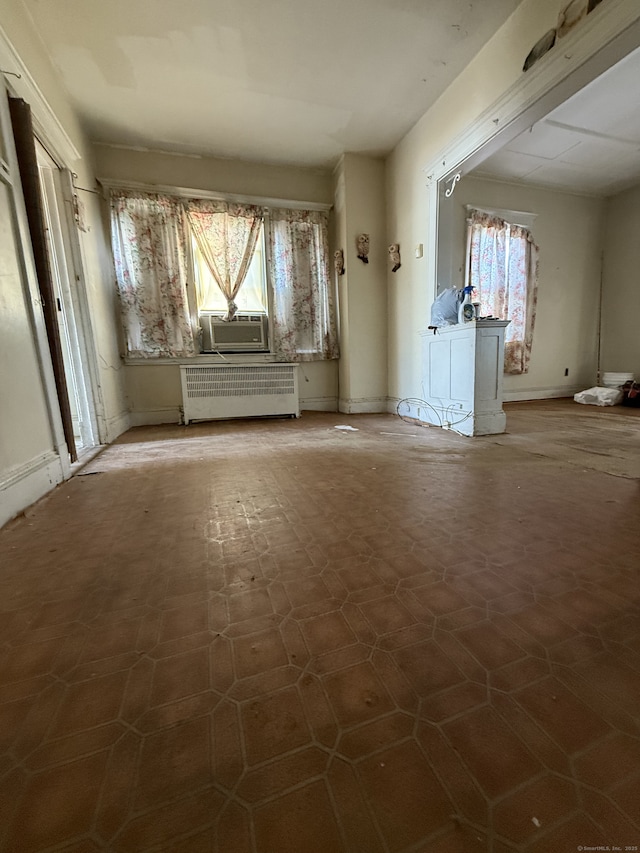 interior space with radiator heating unit and plenty of natural light