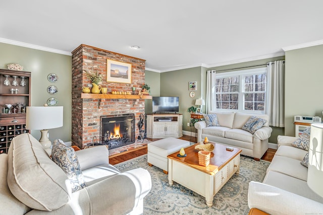 living room featuring light hardwood / wood-style floors, a brick fireplace, and ornamental molding