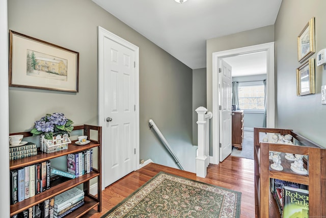 hallway with wood-type flooring