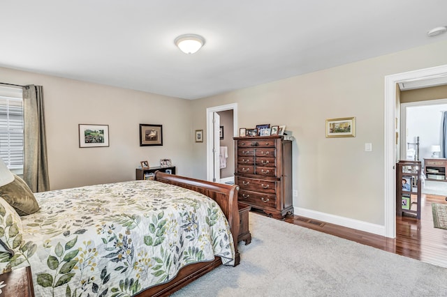 bedroom with wood-type flooring