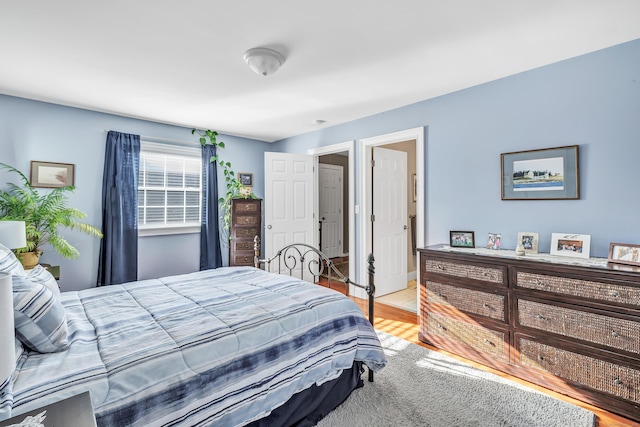 bedroom with light wood-type flooring