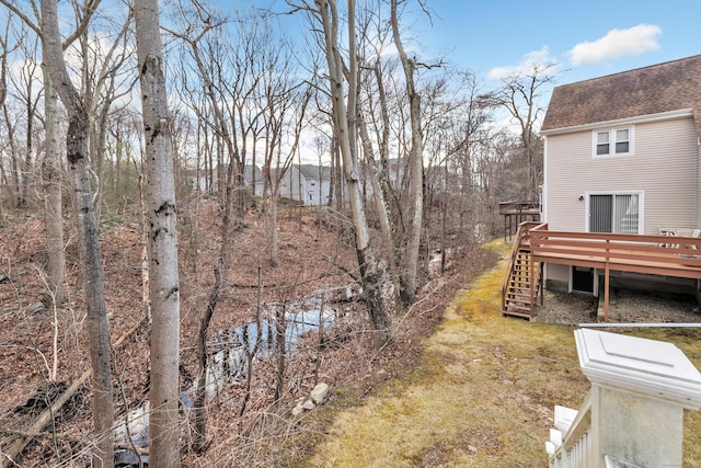 view of yard with a wooden deck