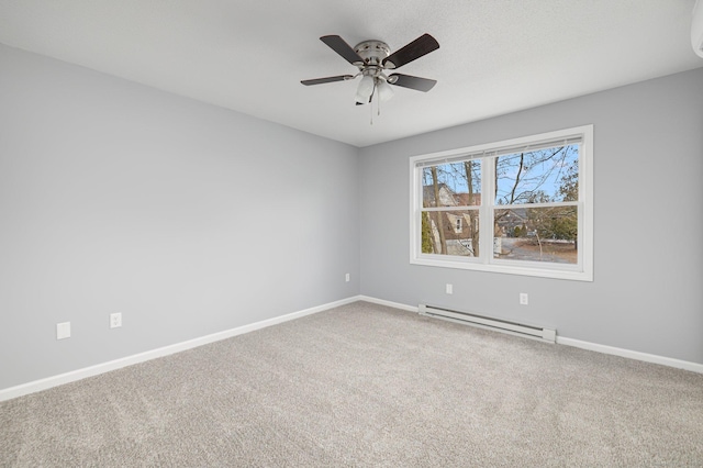 carpeted spare room with ceiling fan and baseboard heating