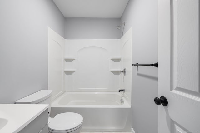 full bathroom featuring bathing tub / shower combination, tile patterned floors, vanity, and toilet