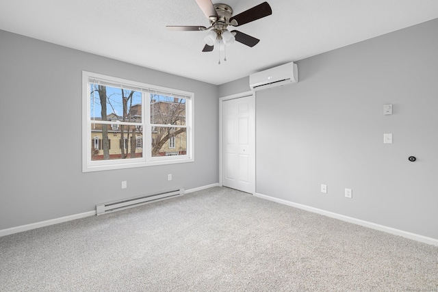 unfurnished bedroom with carpet flooring, a wall mounted AC, ceiling fan, a baseboard radiator, and a closet