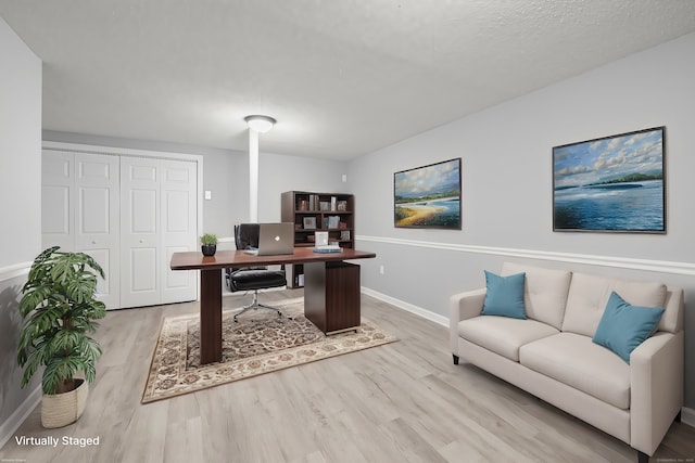 office area with light wood-type flooring