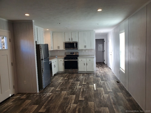 270 Boston Post Rd Unit 22, Waterford, CT 06385 - kitchen featuring white cabinets, dark hardwood / wood-style flooring, crown molding, and appliances with stainless steel finishes