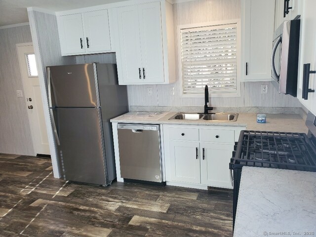 270 Boston Post Rd Unit 22, Waterford, CT 06385 - kitchen featuring ornamental molding, stainless steel appliances, sink, dark hardwood / wood-style floors, and white cabinetry