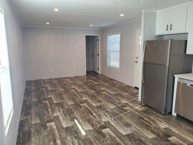 270 Boston Post Rd Unit 22, Waterford, CT 06385 - kitchen with stainless steel appliances, wooden walls, dark wood-type flooring, crown molding, and white cabinets