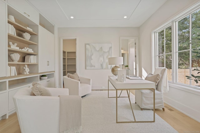 home office with light wood-type flooring