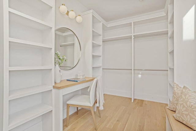 spacious closet featuring light hardwood / wood-style flooring