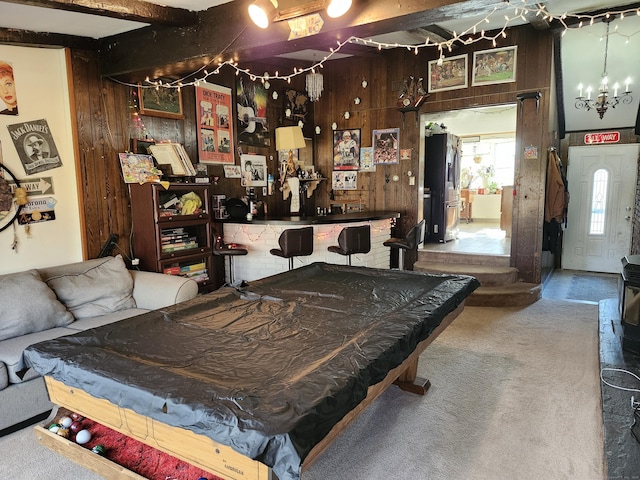 recreation room with beam ceiling, wood walls, carpet, and pool table