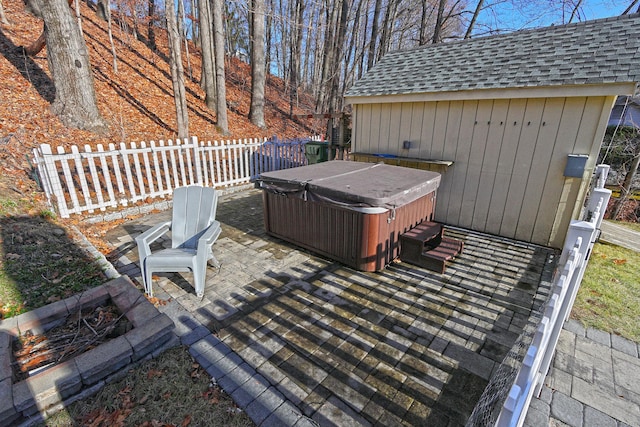 view of patio / terrace with a hot tub